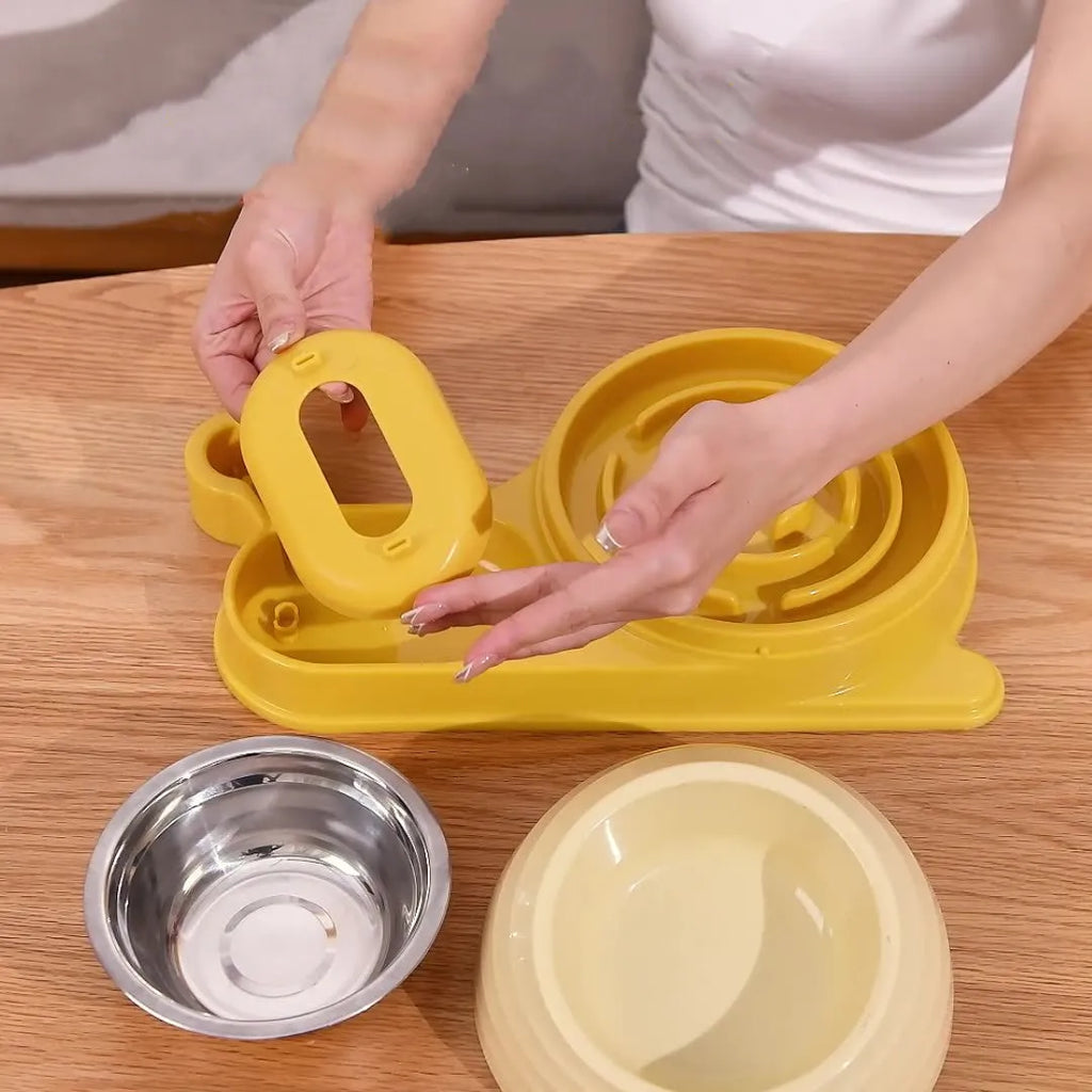 Elevated brown plastic cat food bowl with attached water bottle dispenser