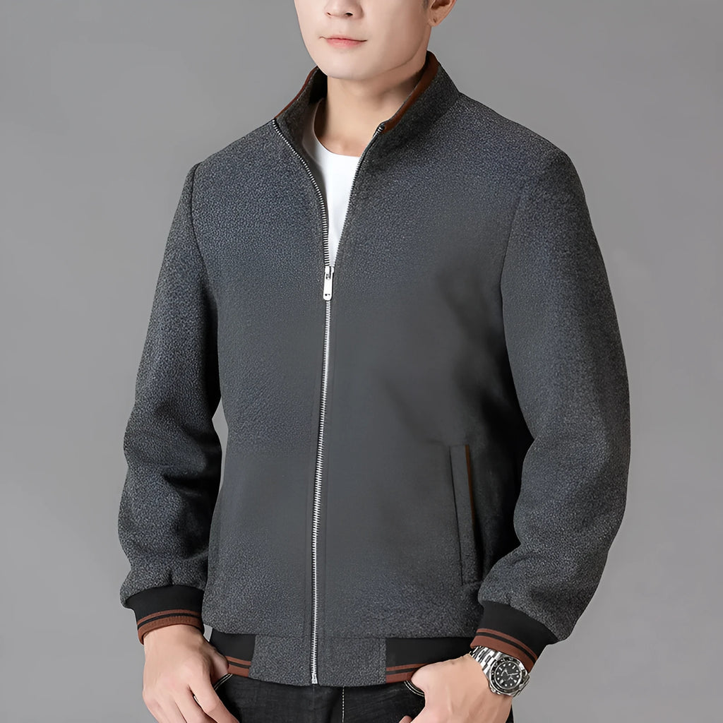Men's grey sports-style fleece jacket with long sleeves and a zip chest pocket.