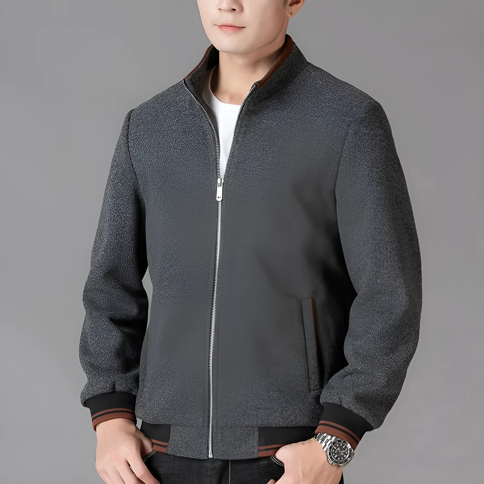 Men's grey sports-style fleece jacket with long sleeves and a zip chest pocket.