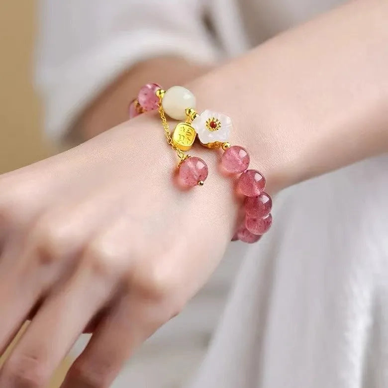 Handcrafted strawberry quartz crystal bracelet with Hetian jade peach blossom design for women