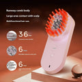 Pink and black smart massage comb for scalp care with red light therapy, shown next to a ruler under 10cm.