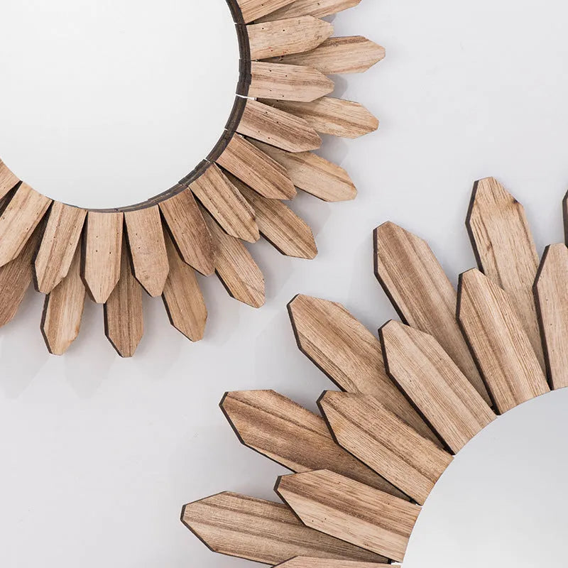 Circular wooden hanging mirror with a baked colour finish on a plain wall.