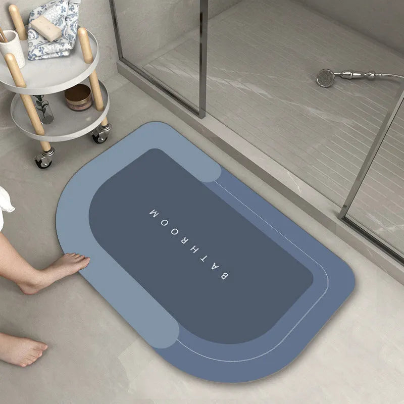 Bathroom floor mat in blue colour, oval shape, showing machine-woven blended texture