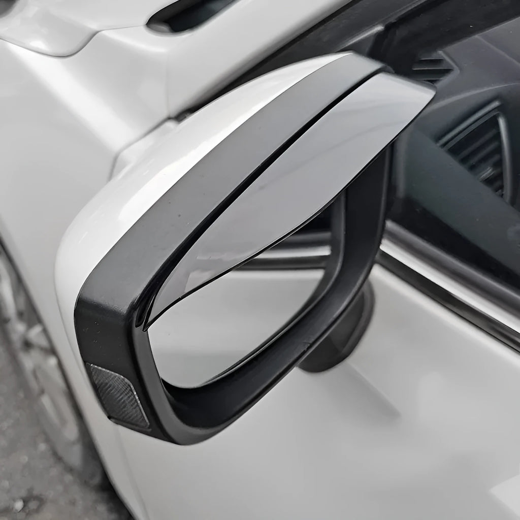 Pair of Mazda reversing mirror rain barrier strips in carbon fibre pattern on a Mazda CX5 side mirror