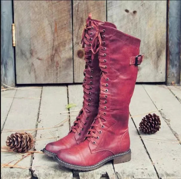Women's black casual high-leg boots with a chunky low heel and round toe.