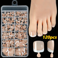 Box of 120 French white edge artificial toenails in square short shape, showing nine nude colour shades.