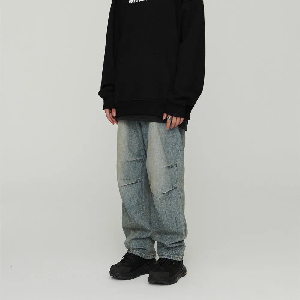 Light wash grey baggy oversized denim jeans with pleats, straight leg, 100% cotton, distressed washed blue