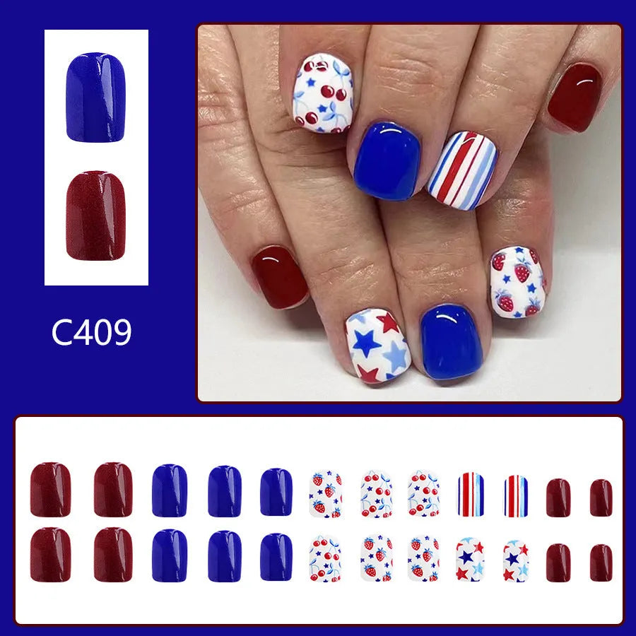 Set of 24 glossy red and blue press-on nail stickers with a strawberry pattern design for Independence Day.