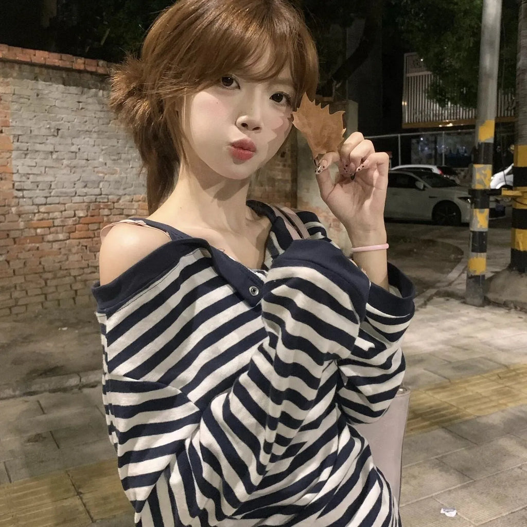 Dark blue Korean-style oversized women's long-sleeve t-shirt with stripe and embroidery detail.