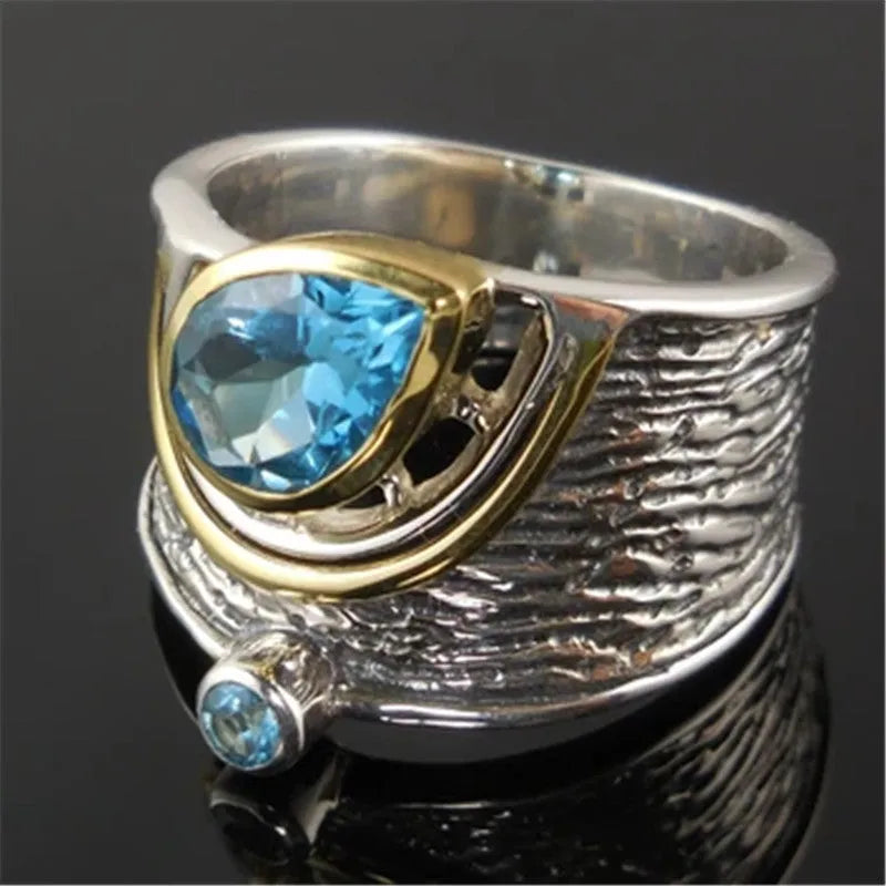 Women's blue zircon ring with Chinese style design and drop shape, shown in alloy.