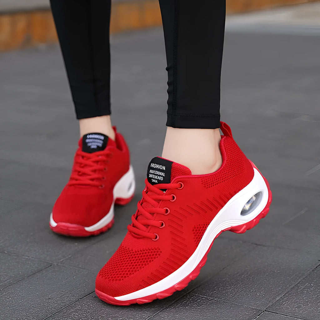 Women's black low top mesh sneakers with front laces and a round toe on a PU sole.