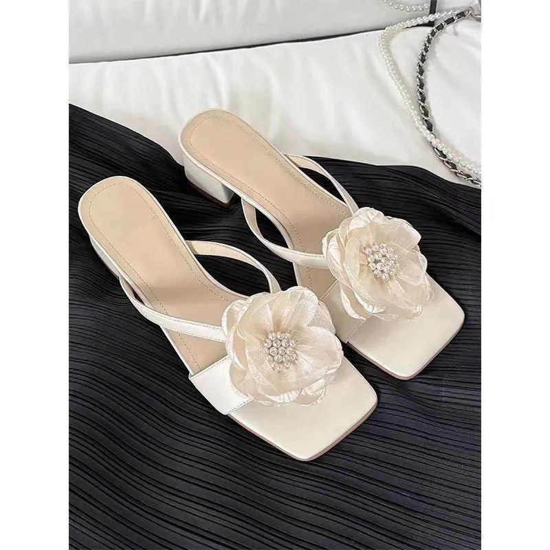 Women's cream satin sandals with a chunky block heel, square toe, and single cross-strap.