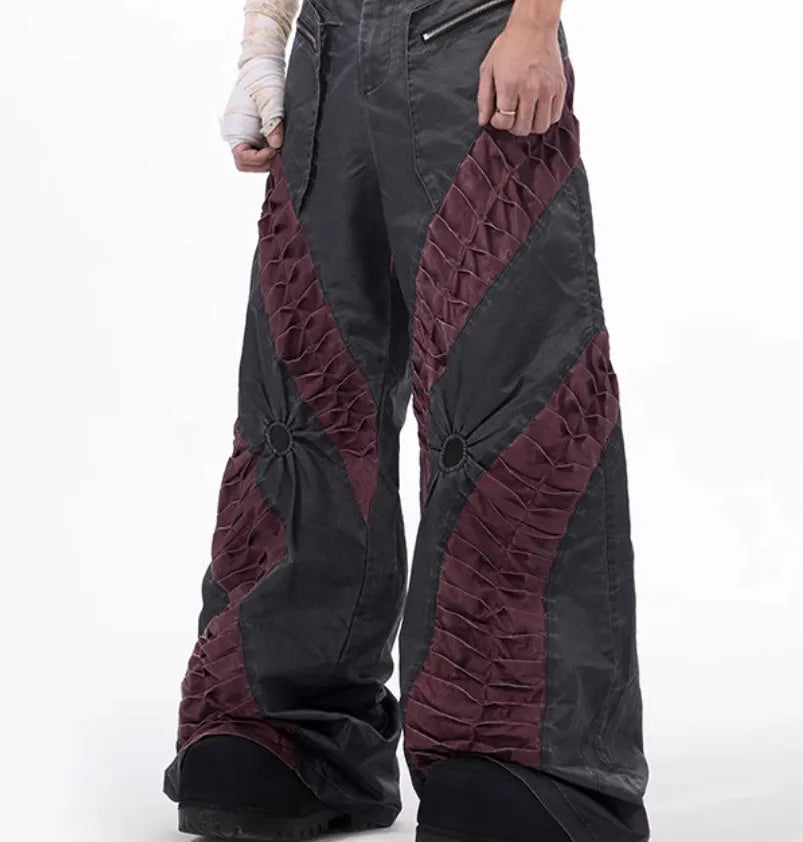 Men's slim-fit grey trousers with textured keel detailing on the legs.