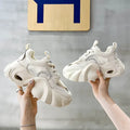Women's beige sneakers with a cross strap and thick sole