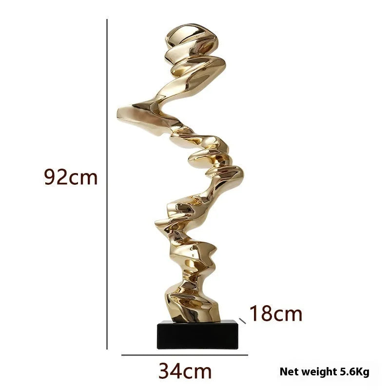 Modern abstract still life sculpture ornament in natural resin on a wooden table.