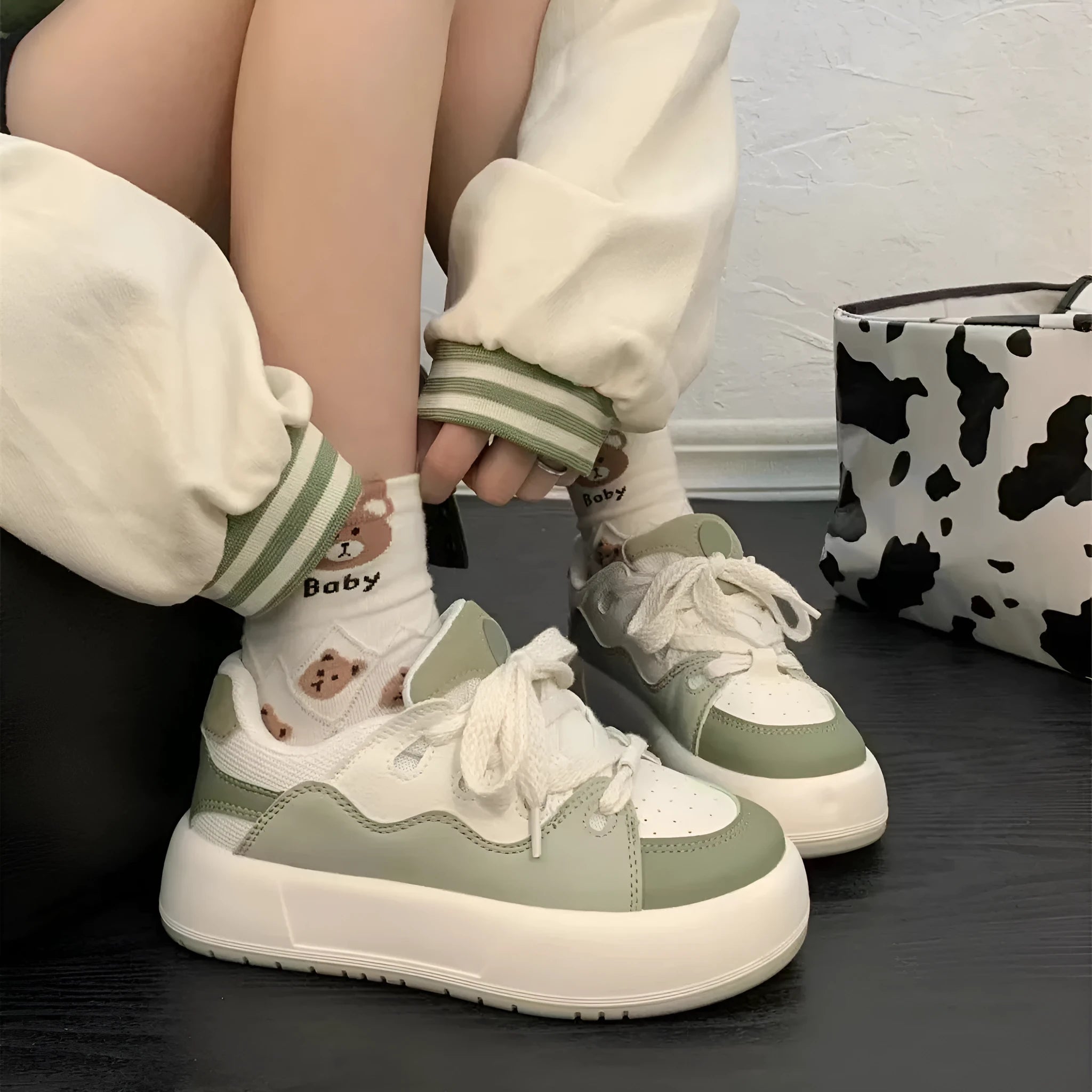 Green women's casual shoes with flat heel and round toe featuring mesh lining