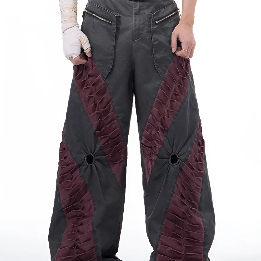 Men's slim-fit grey trousers with textured keel detailing on the legs.