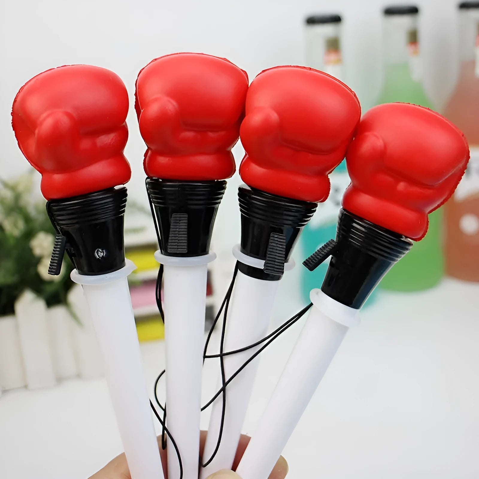 Set of four black pressure relief pens with boxing press mechanism and 0.7mm tips.