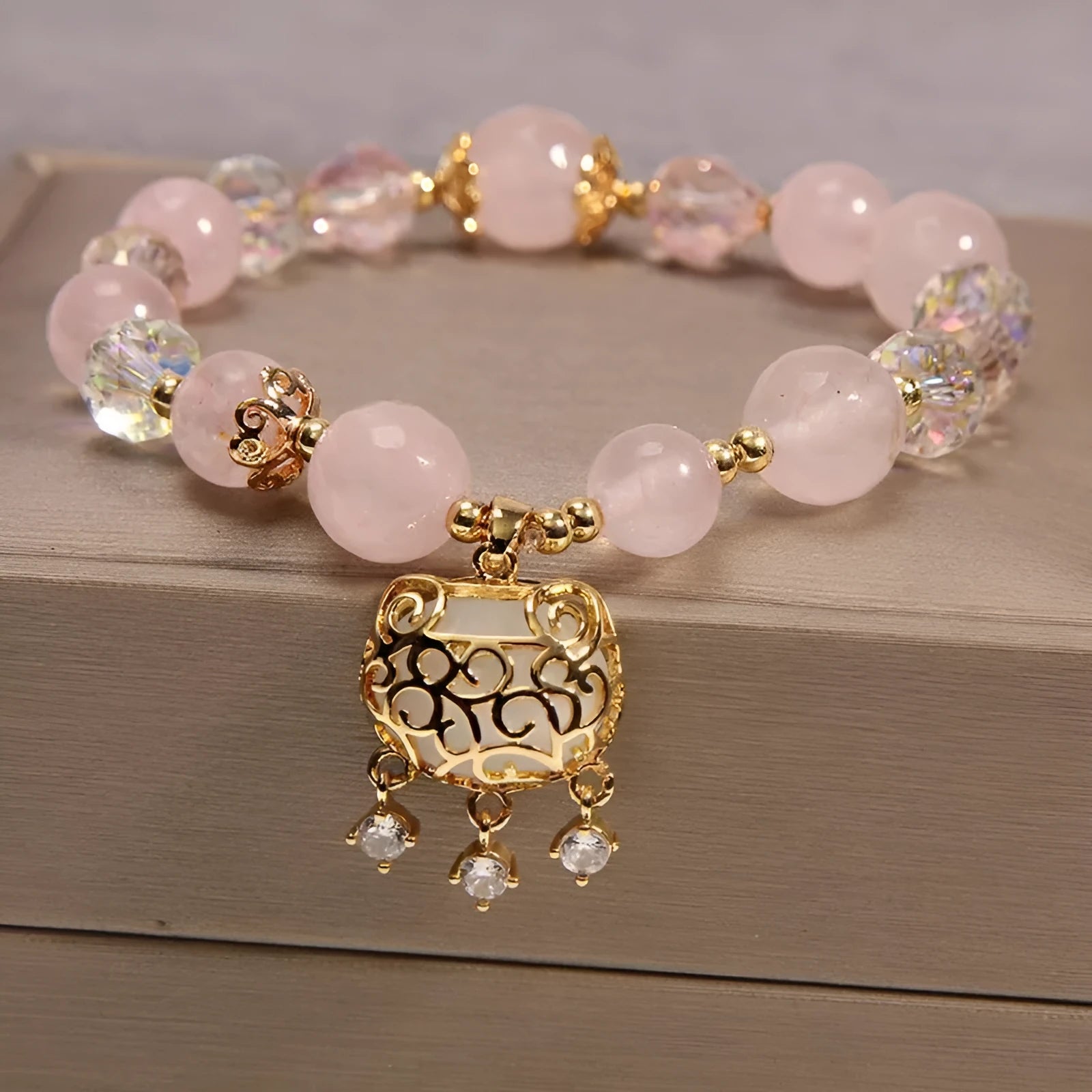 Women's khaki yellow agate crystal bracelet on a gold silk cord.