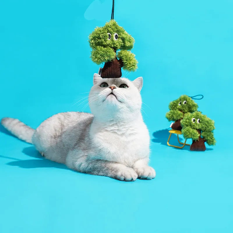 Green pine tree-shaped cat chew toy with a hanging loop, shown with size options.