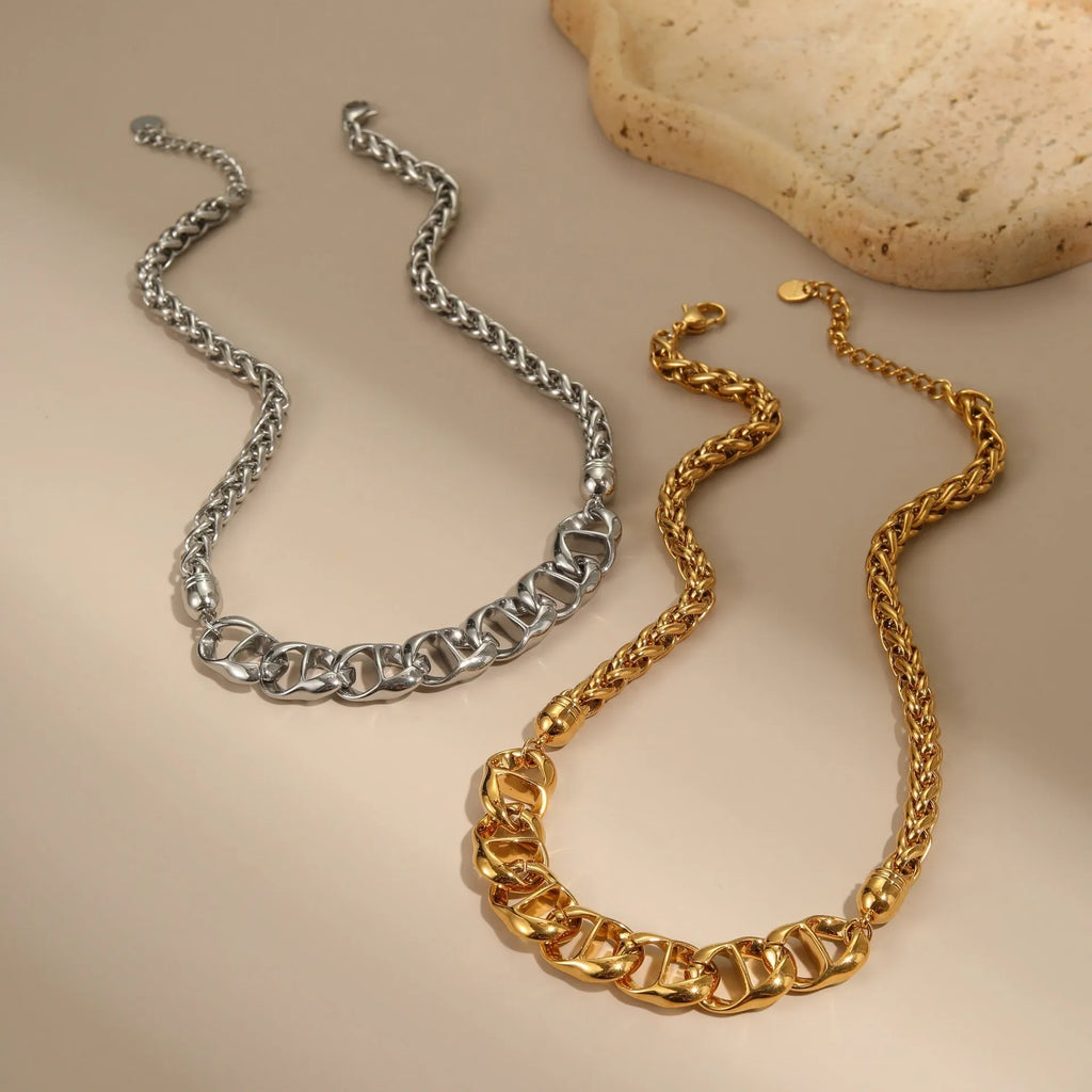 Stainless steel geometric pendant necklace with 18K gold plating in gold and steel colour options.