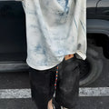 Solid colour oversized short sleeve T-shirt on a hanger, loose fit round neck.
