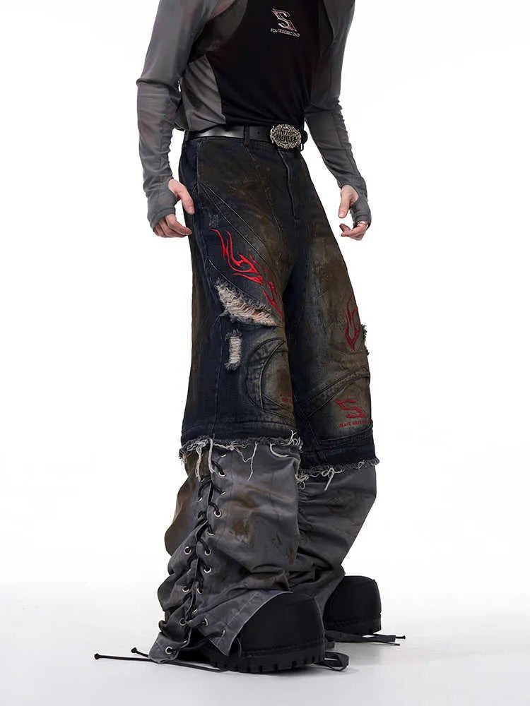 Man wearing retro-style wide-leg denim jeans with detachable lower trouser legs.