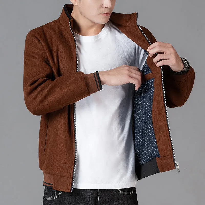 Men's grey sports-style fleece jacket with long sleeves and a zip chest pocket.