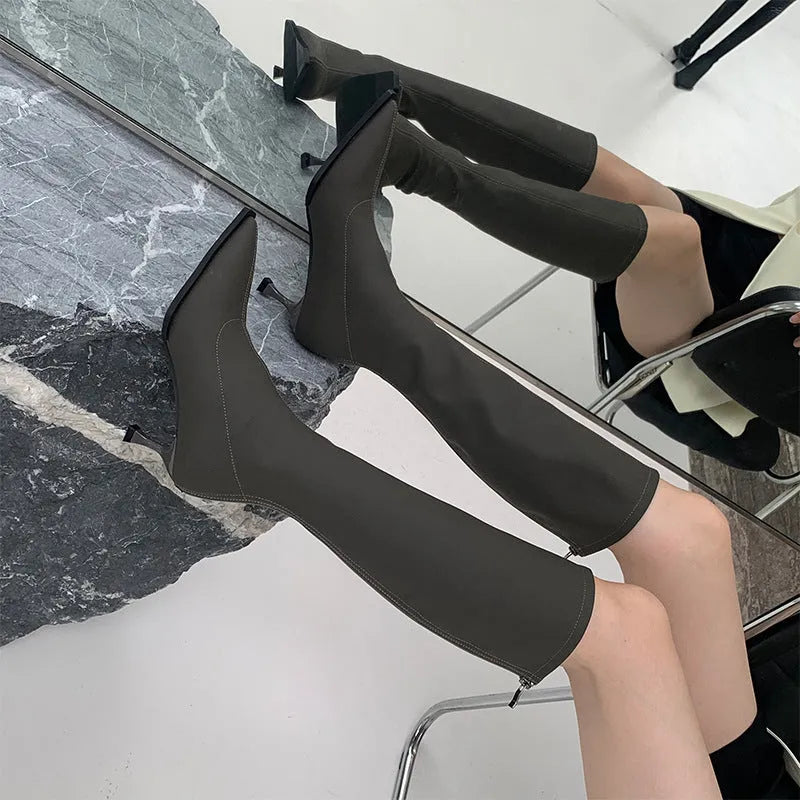 Women's black pointed toe ankle boots with stiletto heel and back zip fastener