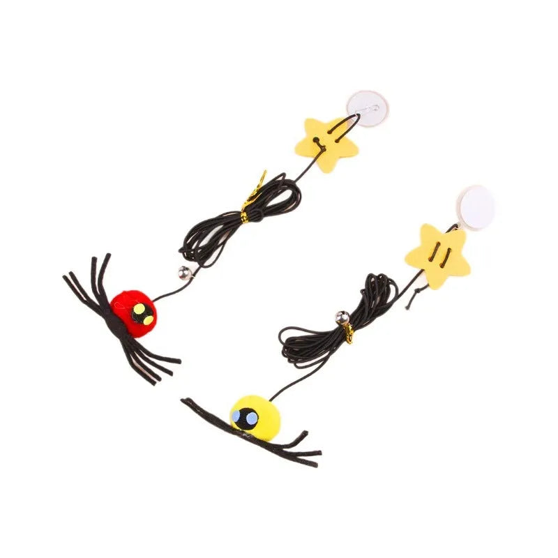 Red and yellow hanging door cat toy with elastic rope, feather, bell, and spider attachments.