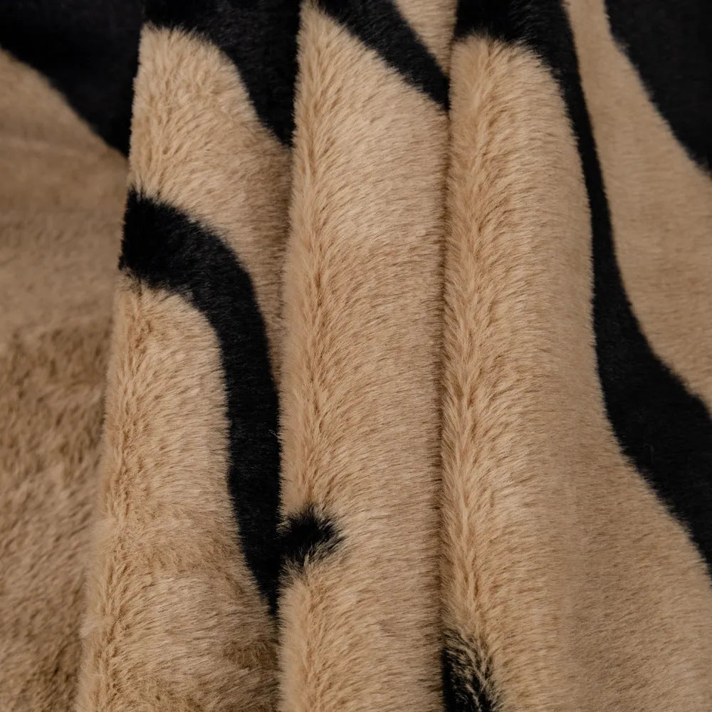 Zebra pattern flannel sofa cover with non-slip backing shown in a caramel colour.