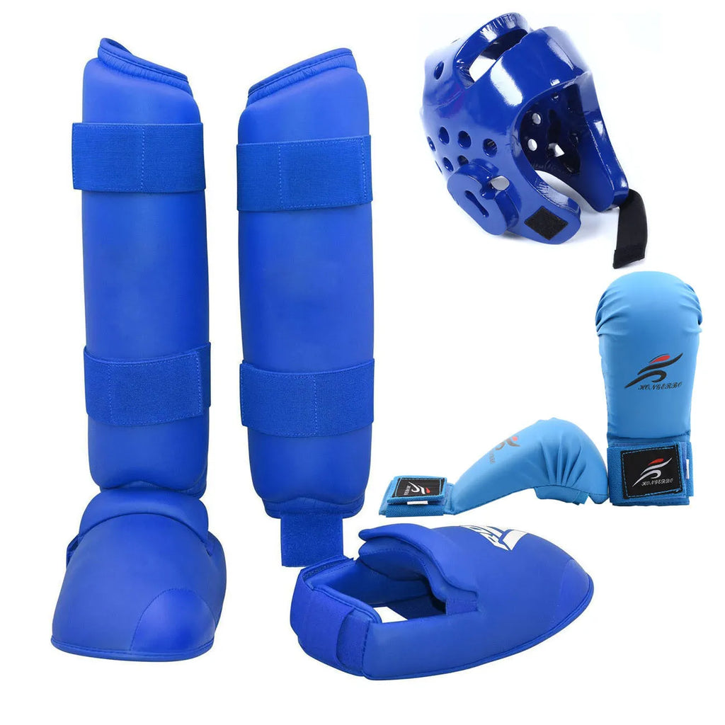 Red karate taekwondo protective gear set with leg guard, helmet and boxing gloves on white background