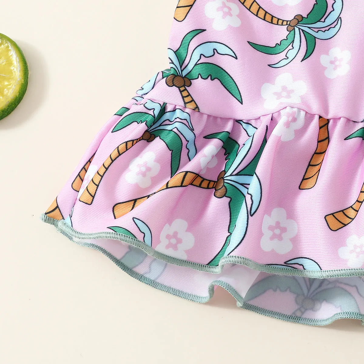 White children's swimsuit set consisting of top and shorts for beach and pool use