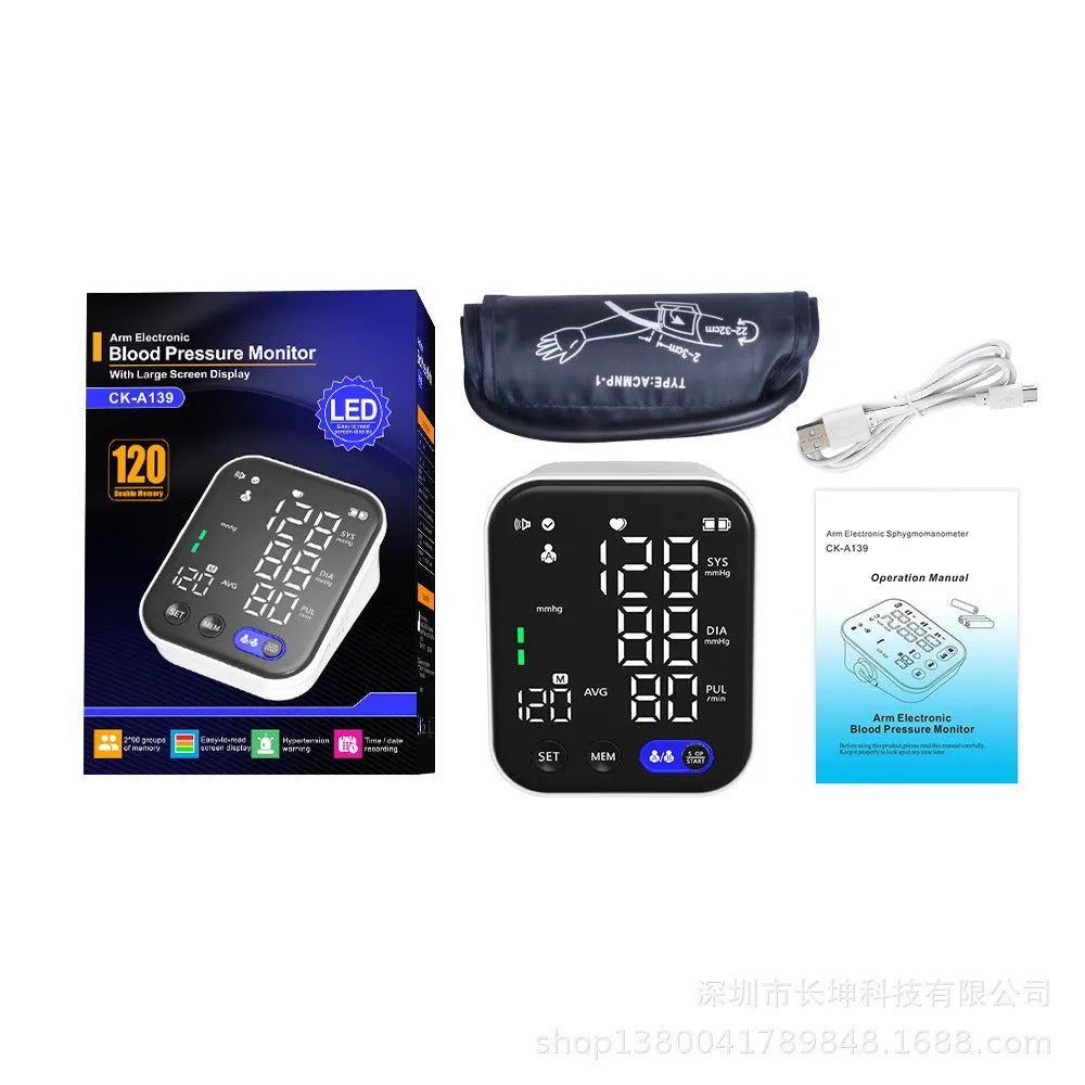White electronic blood pressure monitor with large screen showing blood pressure and pulse readings