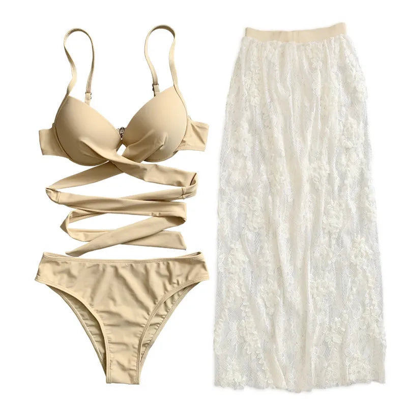Women's white backless push-up bikini three-piece set with matching skirt on a mannequin.