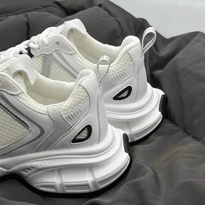 Beige mesh platform sports shoes with wedge heel and lace-up front on white background