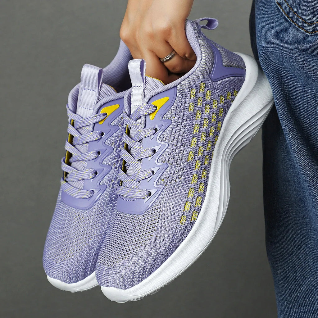 Women's Lavender Purple Flyknit running shoes with striped pattern, mesh upper, and flat EVA sole.