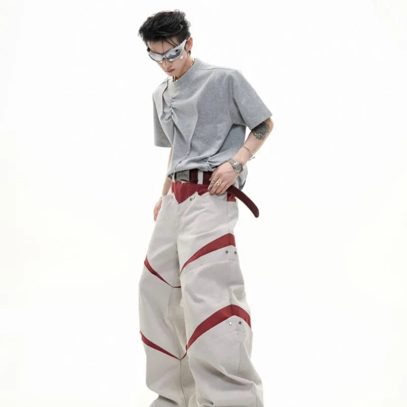 Men's grey cotton T-shirt with loose fit, round neck, and three-dimensional pleated detail on the front.