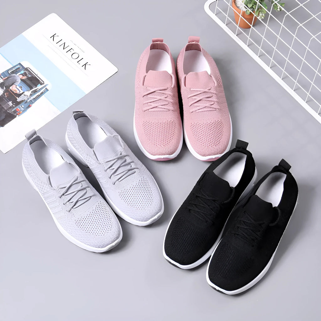 Women's black mesh lace-up casual sneaker with round toe and soft PVC sole.