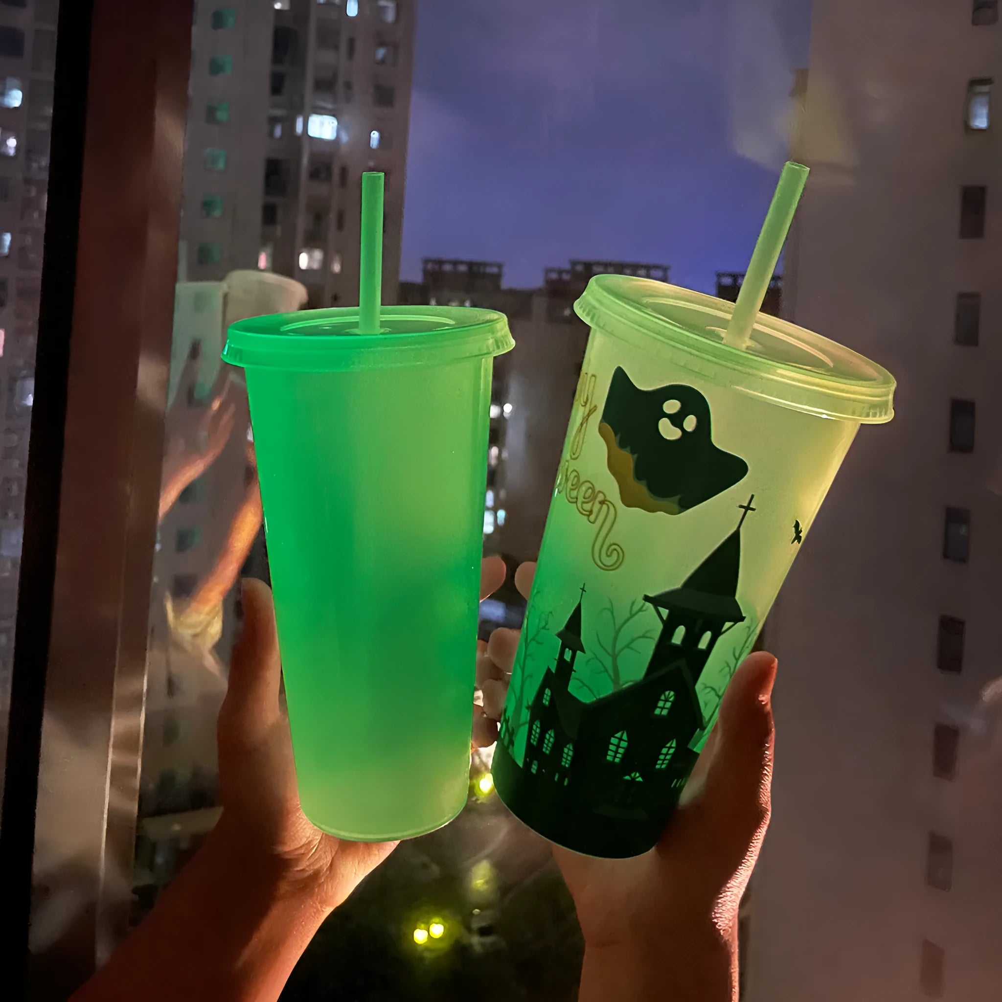 Halloween luminous plastic straw cup with sippy lid, 720ml capacity, in assorted colours.