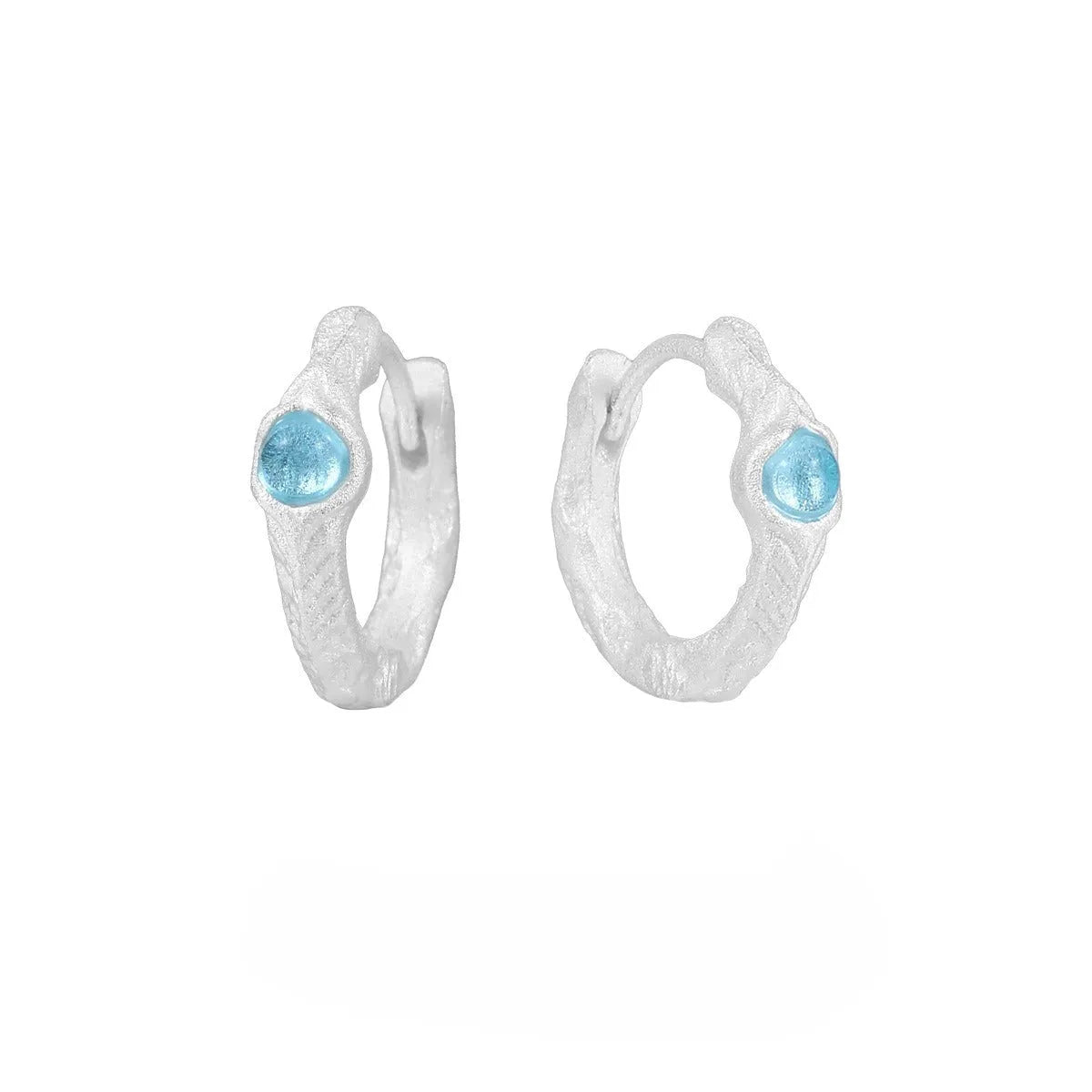 Burnt silver geometric circle ear clips for women made from 925 sterling silver.