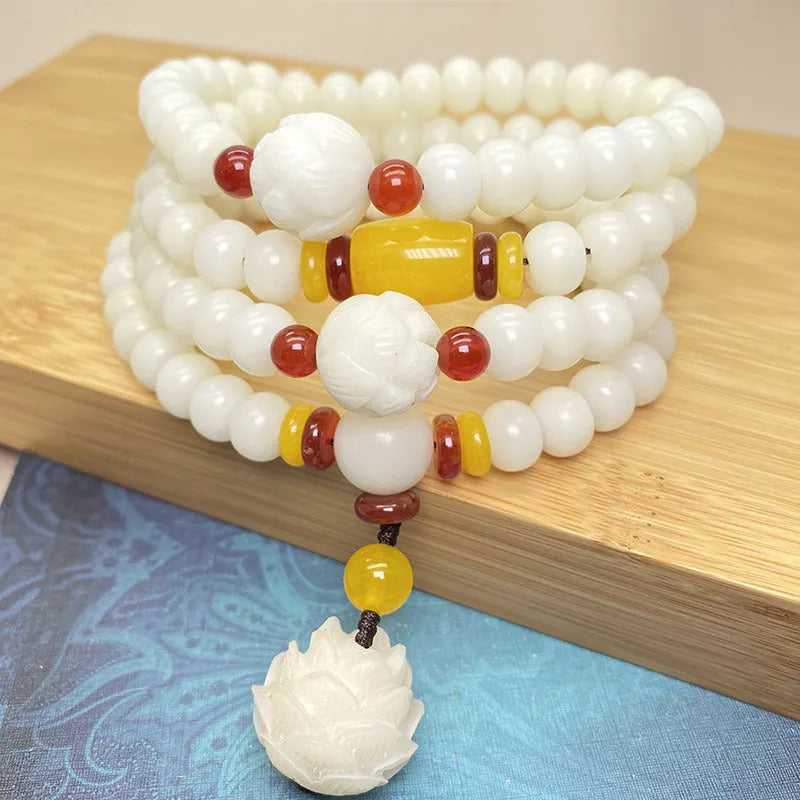White Jade Bodhi stone beaded bracelet with 108 beads on a wrist.