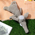Plush dog dental toy with corn kernel texture and animal shape in green colour
