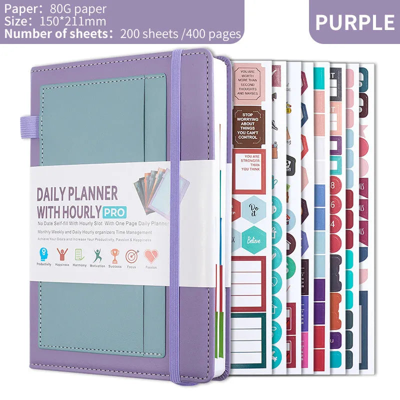 A6 self-filled notebook with PU cover in various colours, shown open on wooden table.