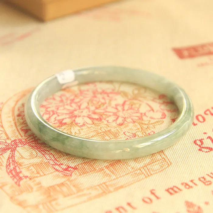 Green jade waxy Chinese bracelet with geometric beads in six wrist sizes from 53mm to 64mm