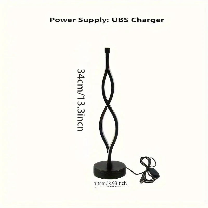 Black aluminium desk lamp on a table showing its three-colour dimming button and touch panel.