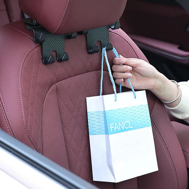 Black car multifunction hook bracket with integrated phone holder for rear seat storage organisation