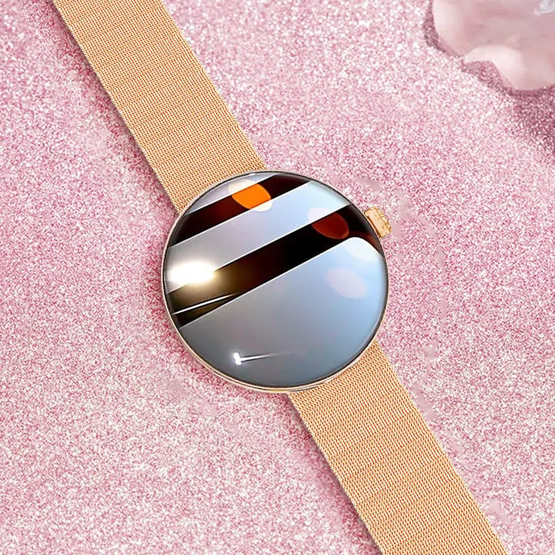 Circular smart watch for women with metal strap, showing colour touch screen display.