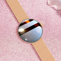 Circular smart watch for women with metal strap, showing colour touch screen display.