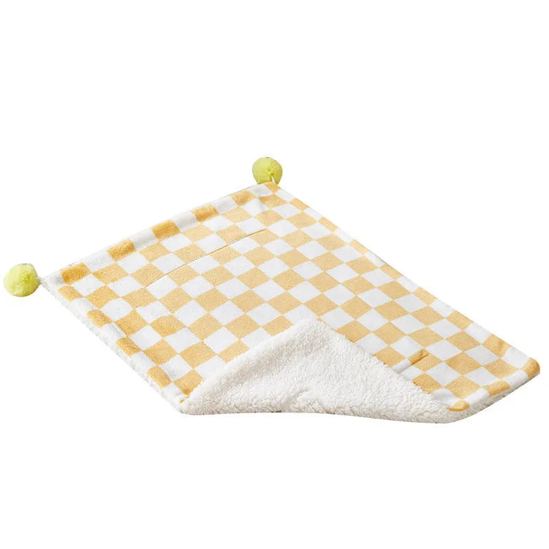 Plaid pattern pet blanket with fur ball decoration in green, pink, or yellow colours on soft fleece material
